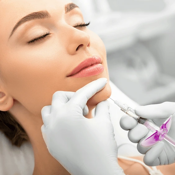 Aesthetic practitioner carefully preparing a facial treatment